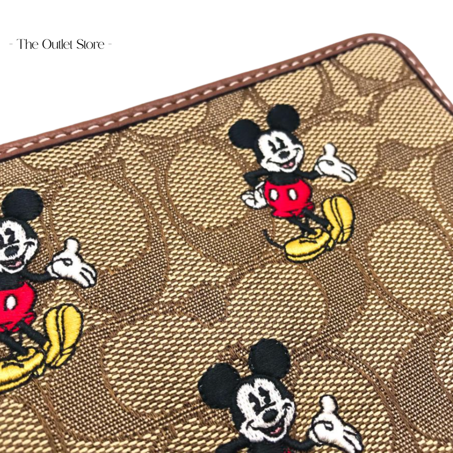 DISNEY X COACH CORNER ZIP WRISTLET IN SIGNATURE JACQUARD WITH MICKEY MOUSE PRINT