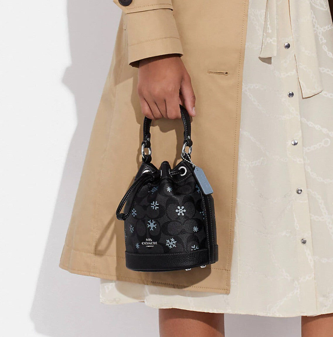 DEMPSEY DRAWSTRING BUCKET BAG 15 IN SIGNATURE CANVAS WITH SNOWFLAKE PRINT